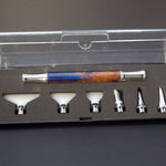 Set of Diamond Painting attachments in a clear plastic case on a gray background