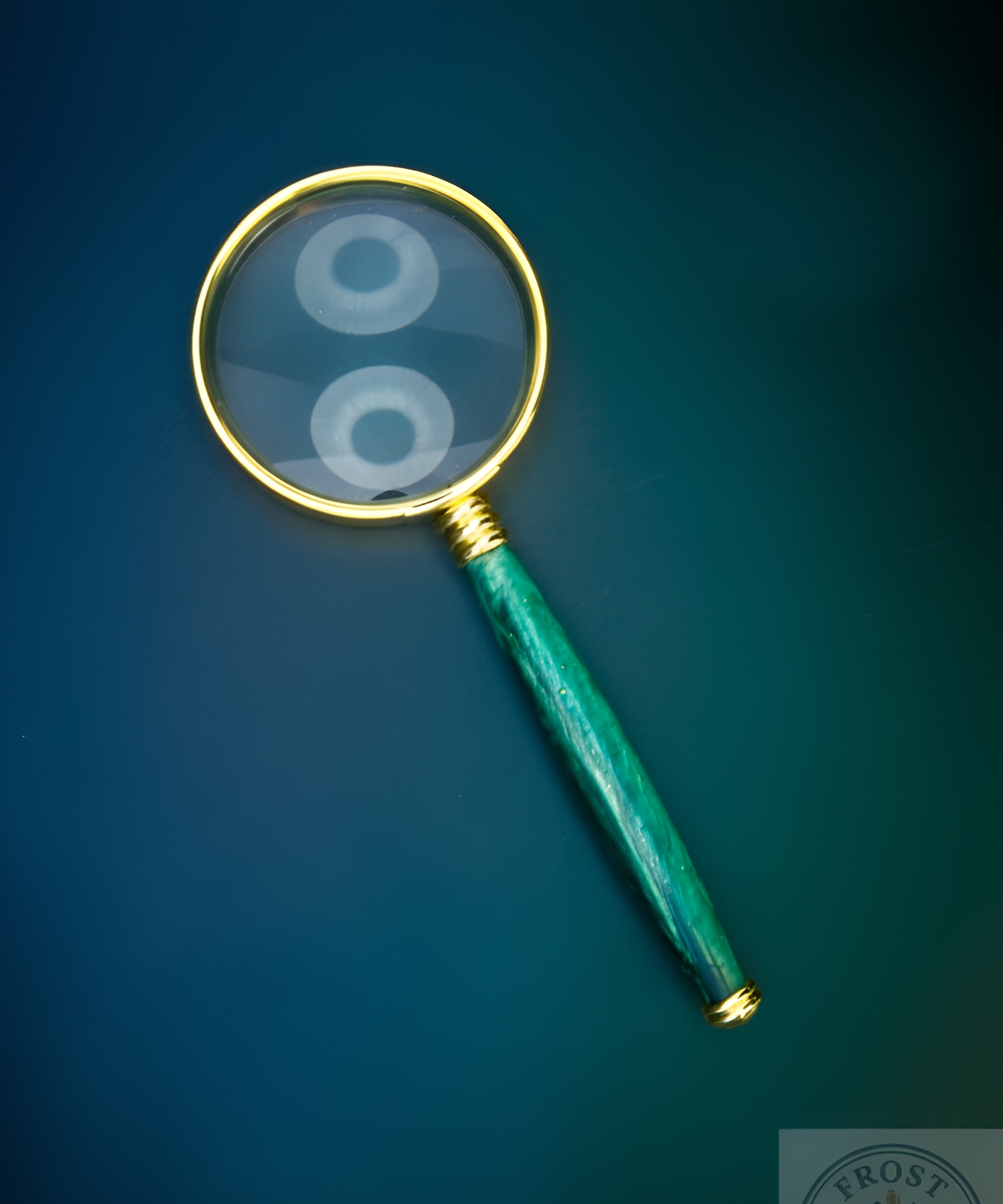 Magnifying glass with a green handle on a blue background