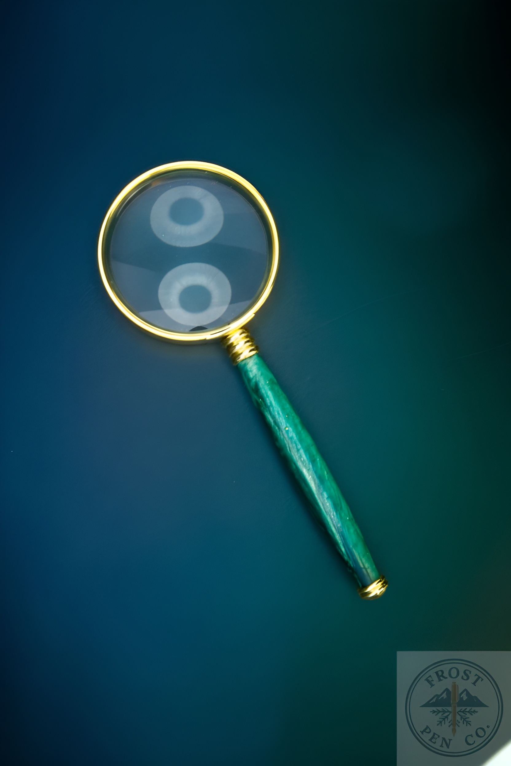 Magnifying glass with a green handle on a blue background